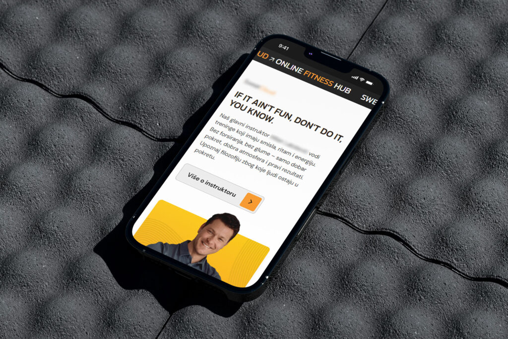 Online Fitness Hub website shown on a smartphone